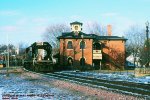 IC, Illinois Central SD70 1002 leads a westbound past the historic Victorian era station at Galena, Illinois. December 8, 1998. 